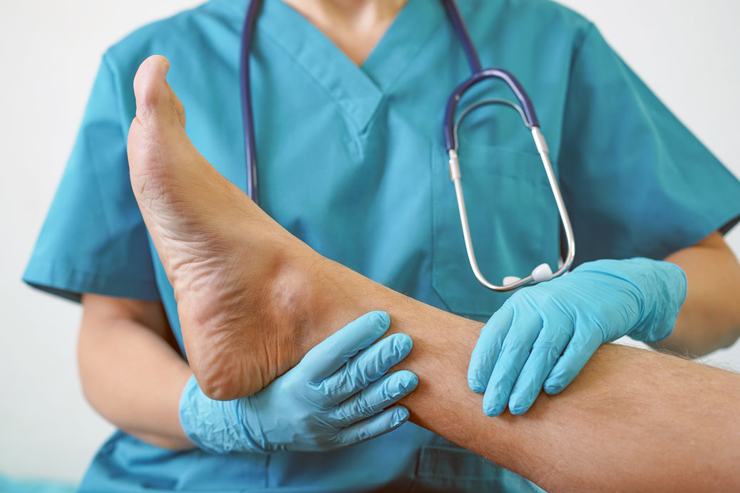 Doctor treating pain in shins